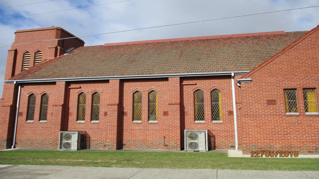 Mossy Terracotta Steep Tiled Roof. Image